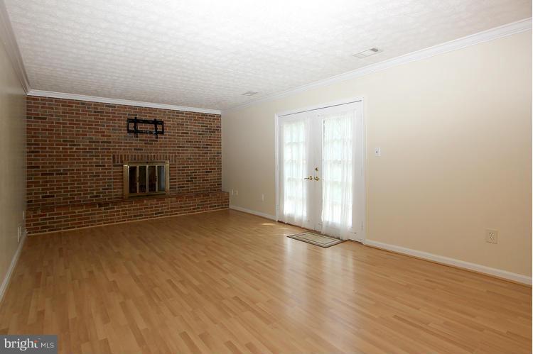 4401 Rendale Court Olney, MD 20832 - Photo 12 of 30 Family Room with brick fireplace