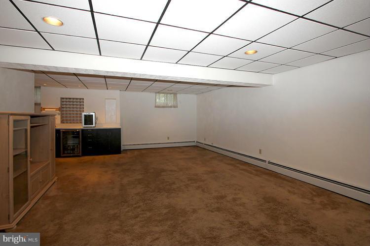 4401 Rendale Court Olney, MD 20832 - Photo 23 of 30 Basement Rec. Room with wet bar & beverage cooler