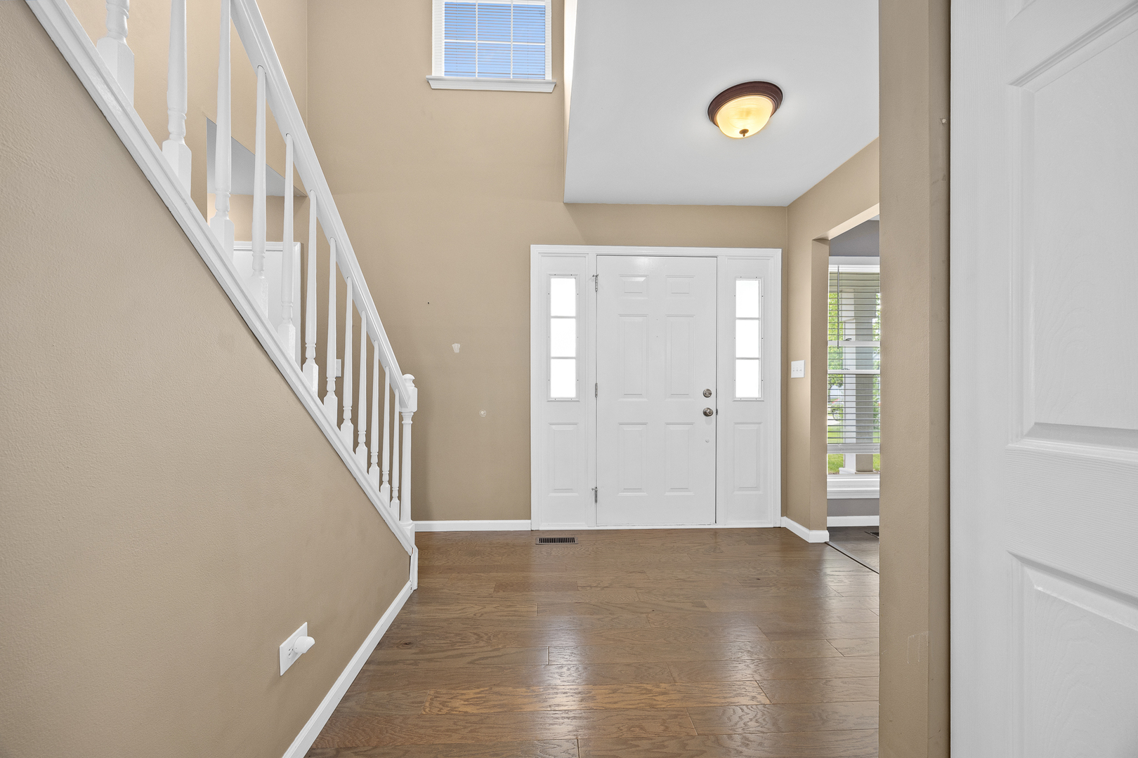 2 Buckboard Court Bolingbrook, IL 60490 - Photo 8 of 33 a view of an entryway with wooden floor