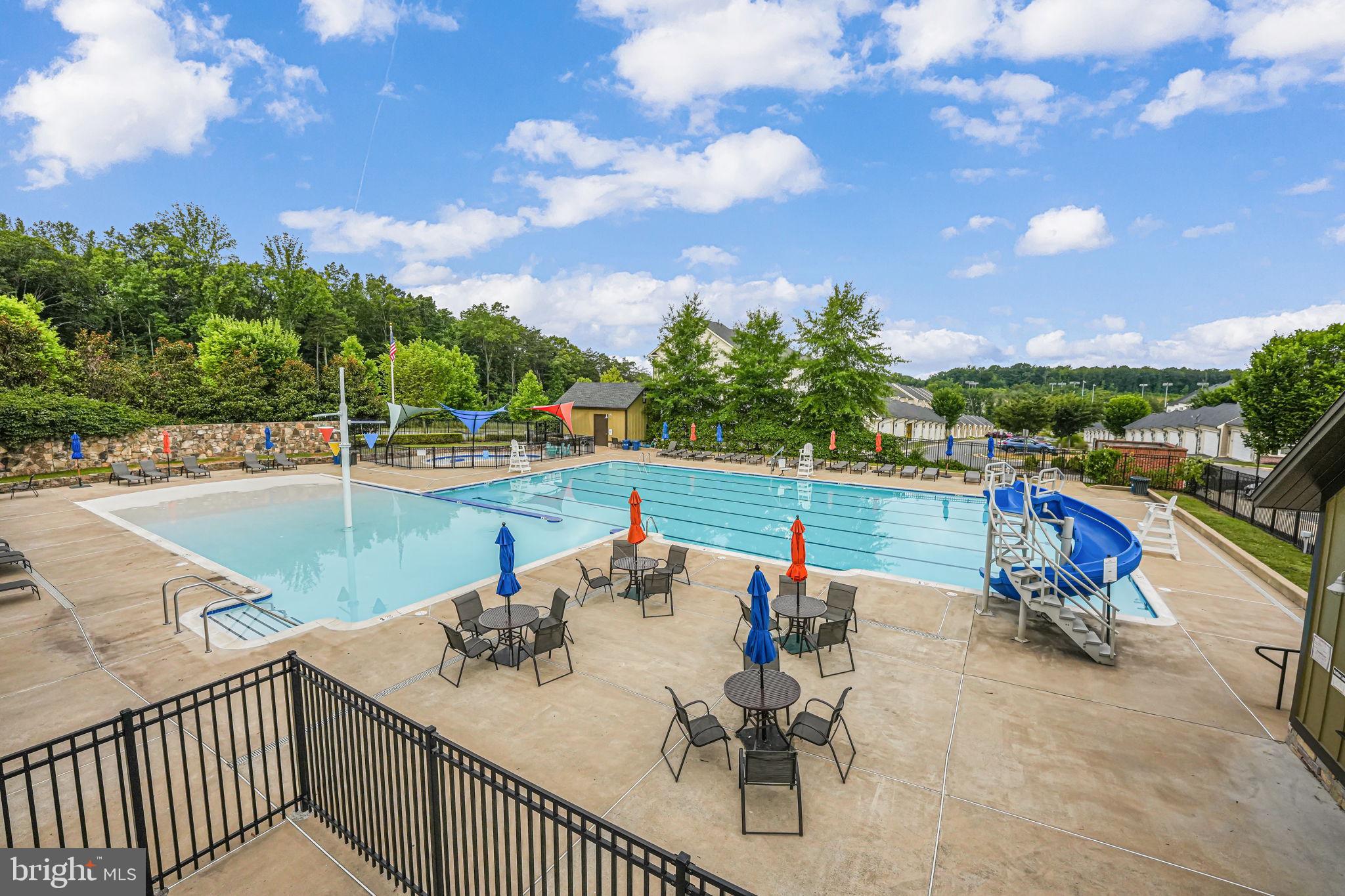 650 Aspen Road, Unit 108 Stafford, VA 22554 - Photo 23 of 26 Sunny oasis with a sparkling pool.