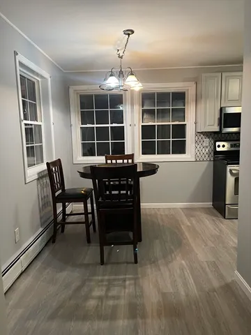 a view of a livingroom with furniture and windows