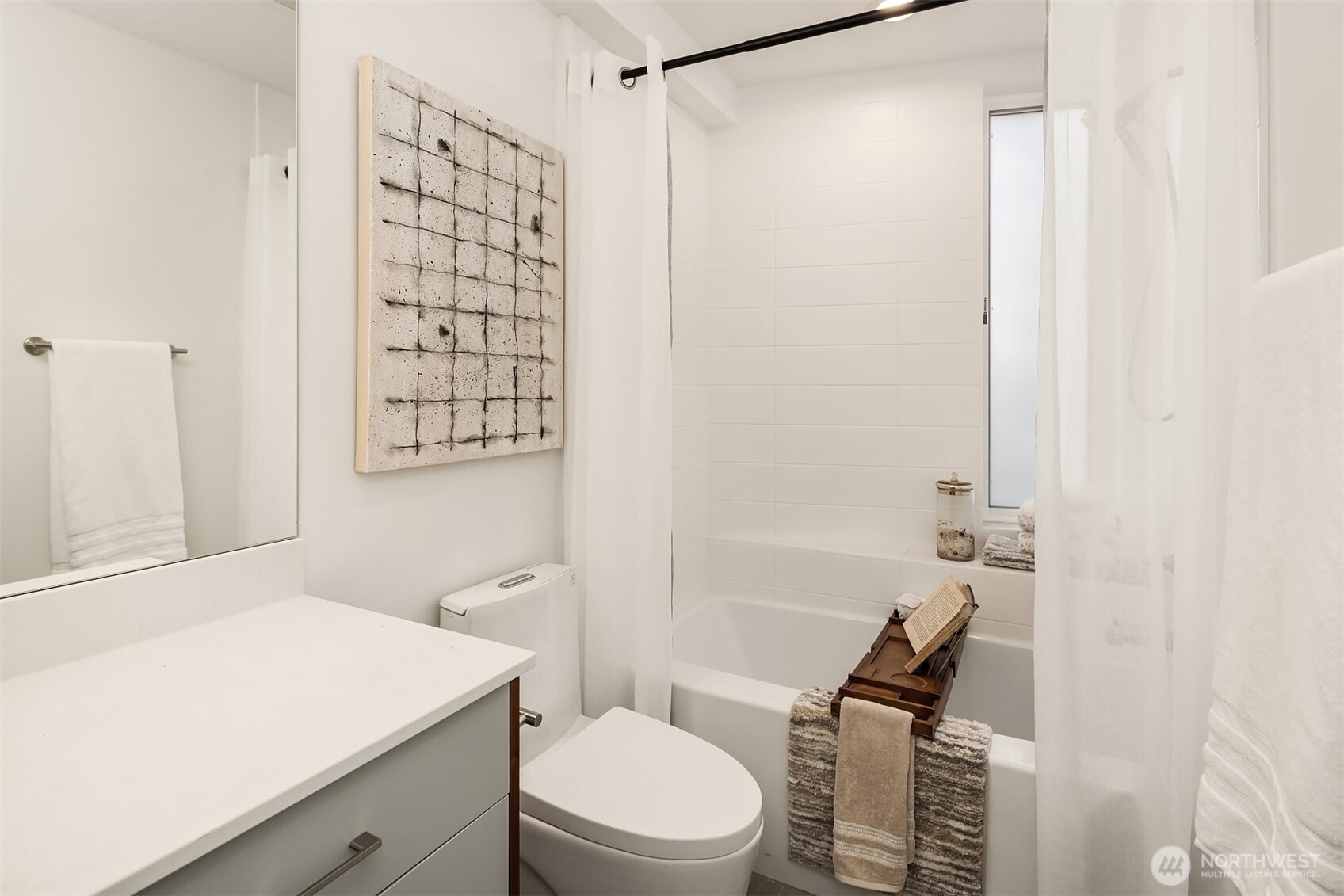 629 13th Avenue East Seattle, WA 98102 - Photo 11 of 36 a bathroom with a shower a toilet and a sink