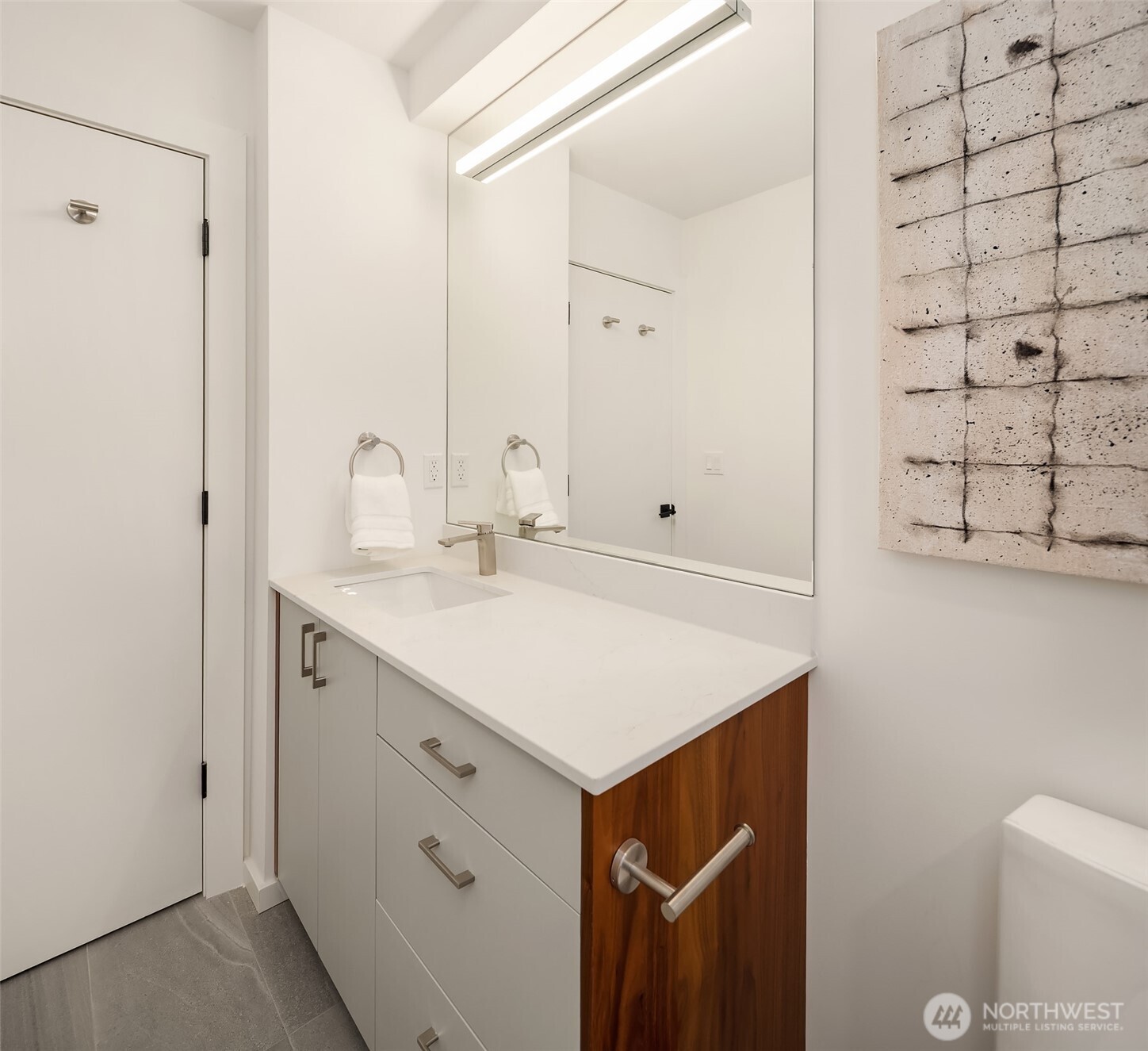 629 13th Avenue East Seattle, WA 98102 - Photo 12 of 36 a bathroom with a sink vanity and a mirror