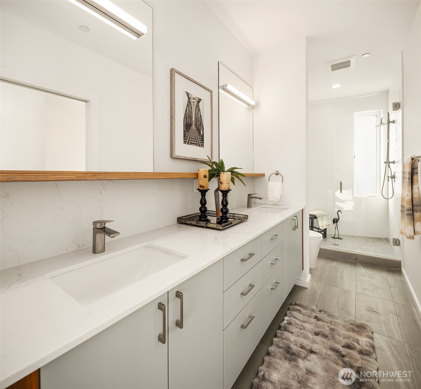 629 13th Avenue East Seattle, WA 98102 - Photo 15 of 36 a bathroom with a double vanity sink mirror and