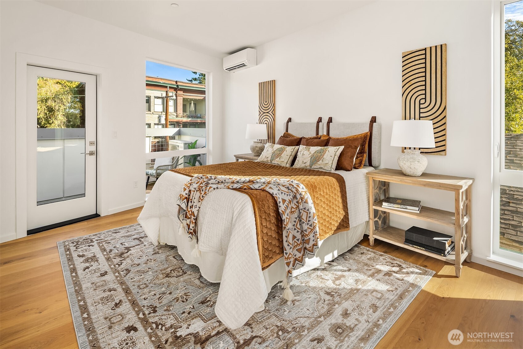 629 13th Avenue East Seattle, WA 98102 - Photo 18 of 36 a spacious bedroom with a bed and wooden floor