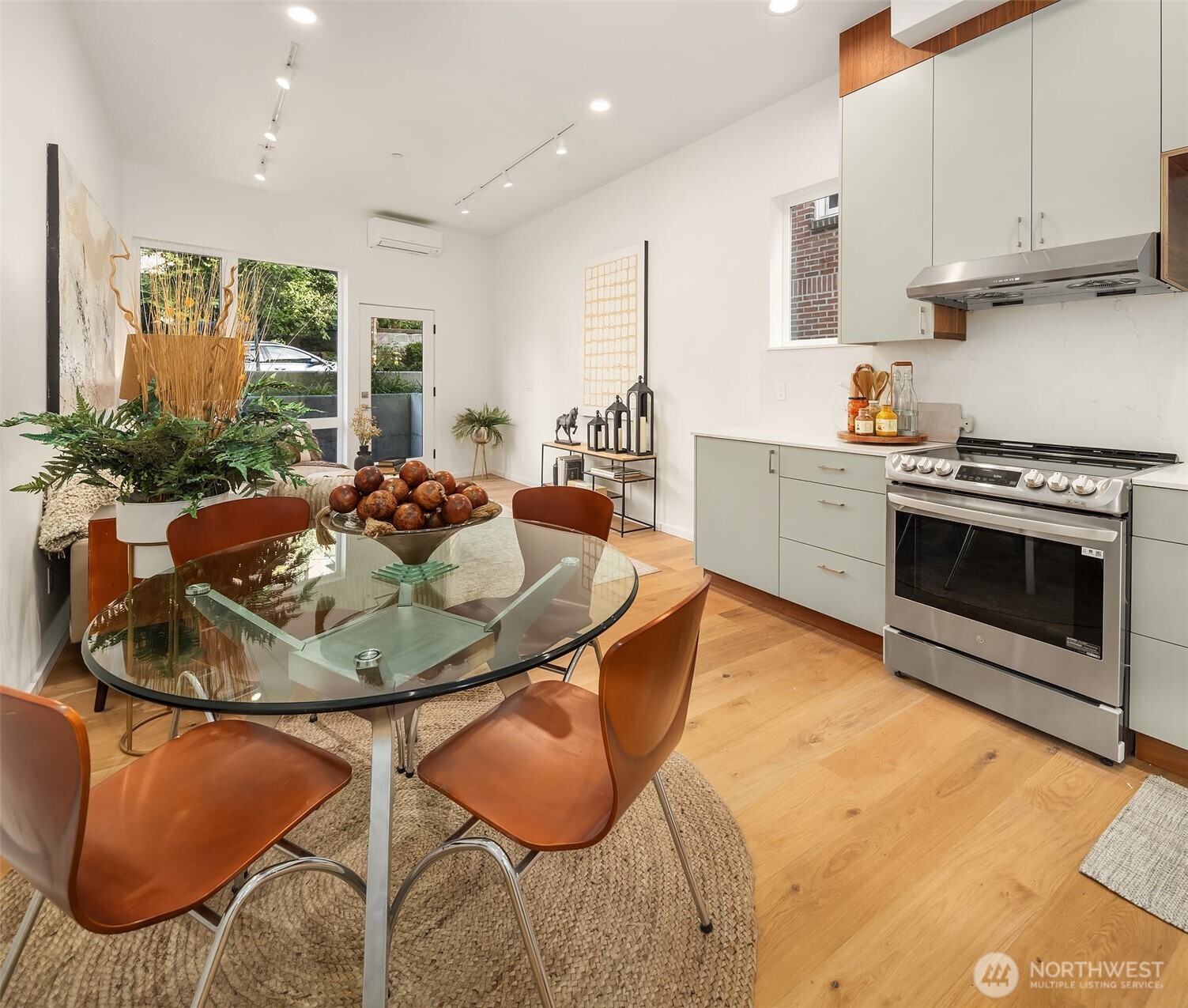 629 13th Avenue East Seattle, WA 98102 - Photo 5 of 36 a kitchen with stainless steel appliances granite countertop a sink and cabinets