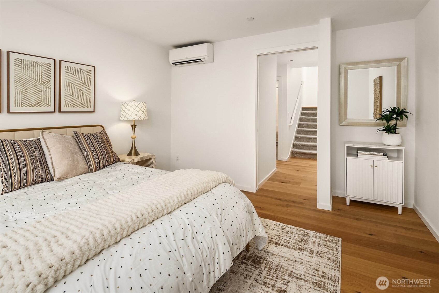 629 13th Avenue East Seattle, WA 98102 - Photo 10 of 36 a bedroom with a bed and wooden floor