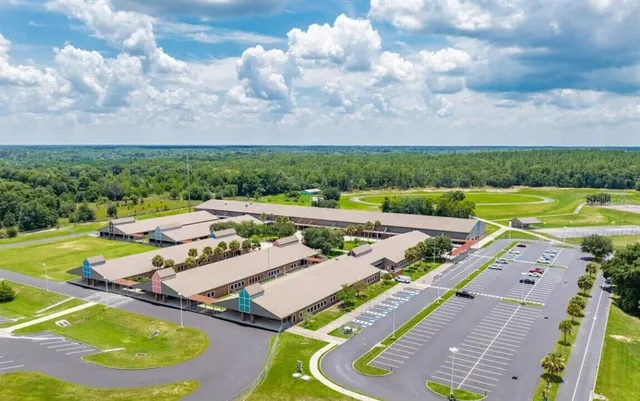 an aerial view of a house with outdoor space