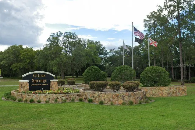 a front view of a house with swimming pool having outdoor seating