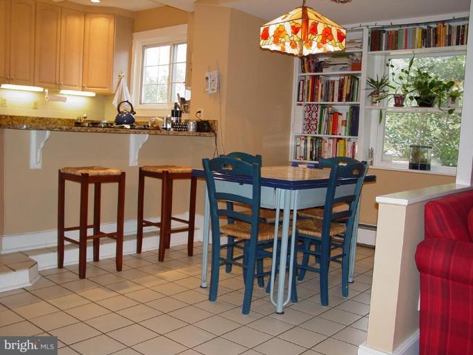 7007 Copeleigh Road Baltimore, MD 21212 - Photo 11 of 30 a dining room filled with furniture and a floor to ceiling window