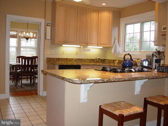 7007 Copeleigh Road Baltimore, MD 21212 - Photo 12 of 30 a kitchen with granite countertop a sink and a cabinets