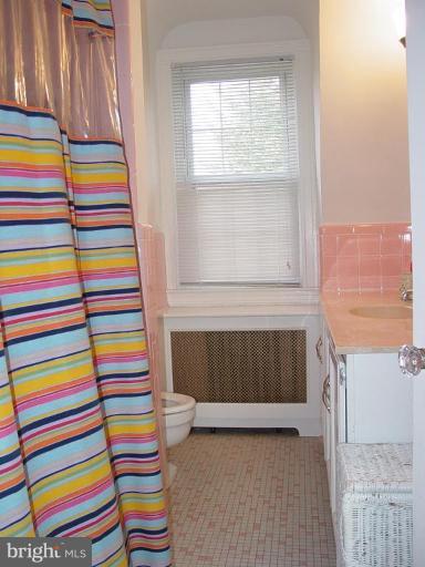 7007 Copeleigh Road Baltimore, MD 21212 - Photo 17 of 30 a bedroom with a bed and a window