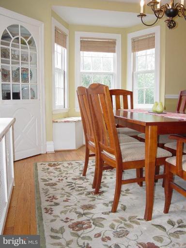 7007 Copeleigh Road Baltimore, MD 21212 - Photo 25 of 30 a view of a dining room with furniture and wooden floor