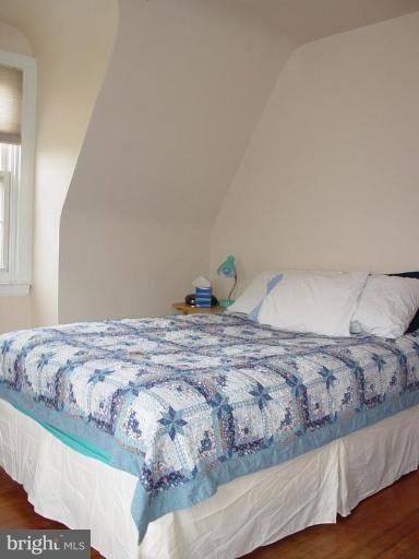 7007 Copeleigh Road Baltimore, MD 21212 - Photo 26 of 30 a bedroom with a bed