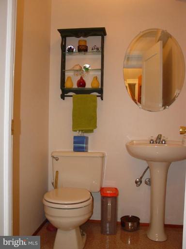 7007 Copeleigh Road Baltimore, MD 21212 - Photo 28 of 30 a bathroom with a toilet sink and mirror
