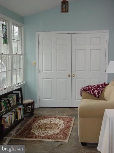 7007 Copeleigh Road Baltimore, MD 21212 - Photo 4 of 30 a living room with furniture and a book shelf