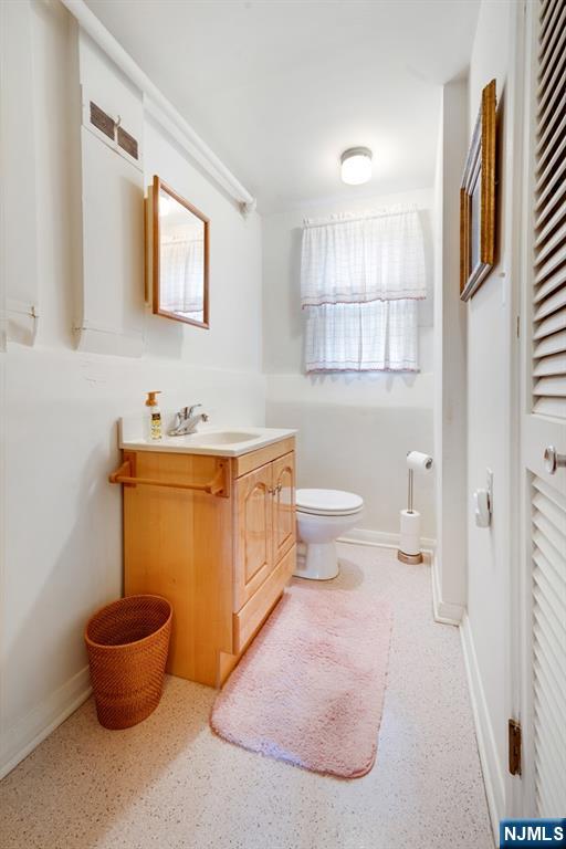 378 Lookout Avenue Hackensack, NJ 07601 - Photo 16 of 32 a bathroom with a toilet sink and mirror