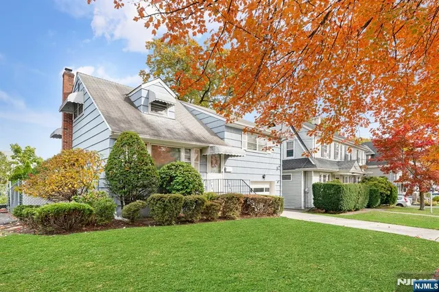 a bedroom with a bed and a mirror
