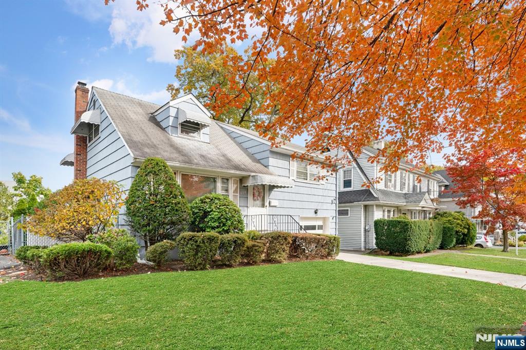 378 Lookout Avenue Hackensack, NJ 07601 - Photo 3 of 32 a front view of a house with a garden