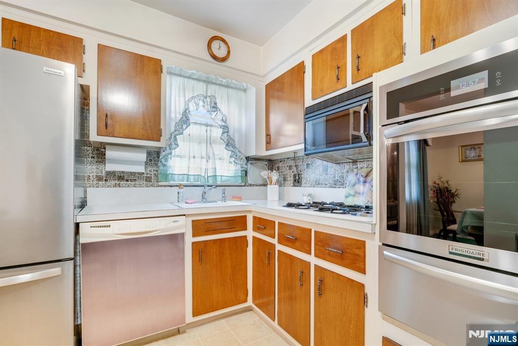 378 Lookout Avenue Hackensack, NJ 07601 - Photo 9 of 32 a kitchen with a sink and chandelier
