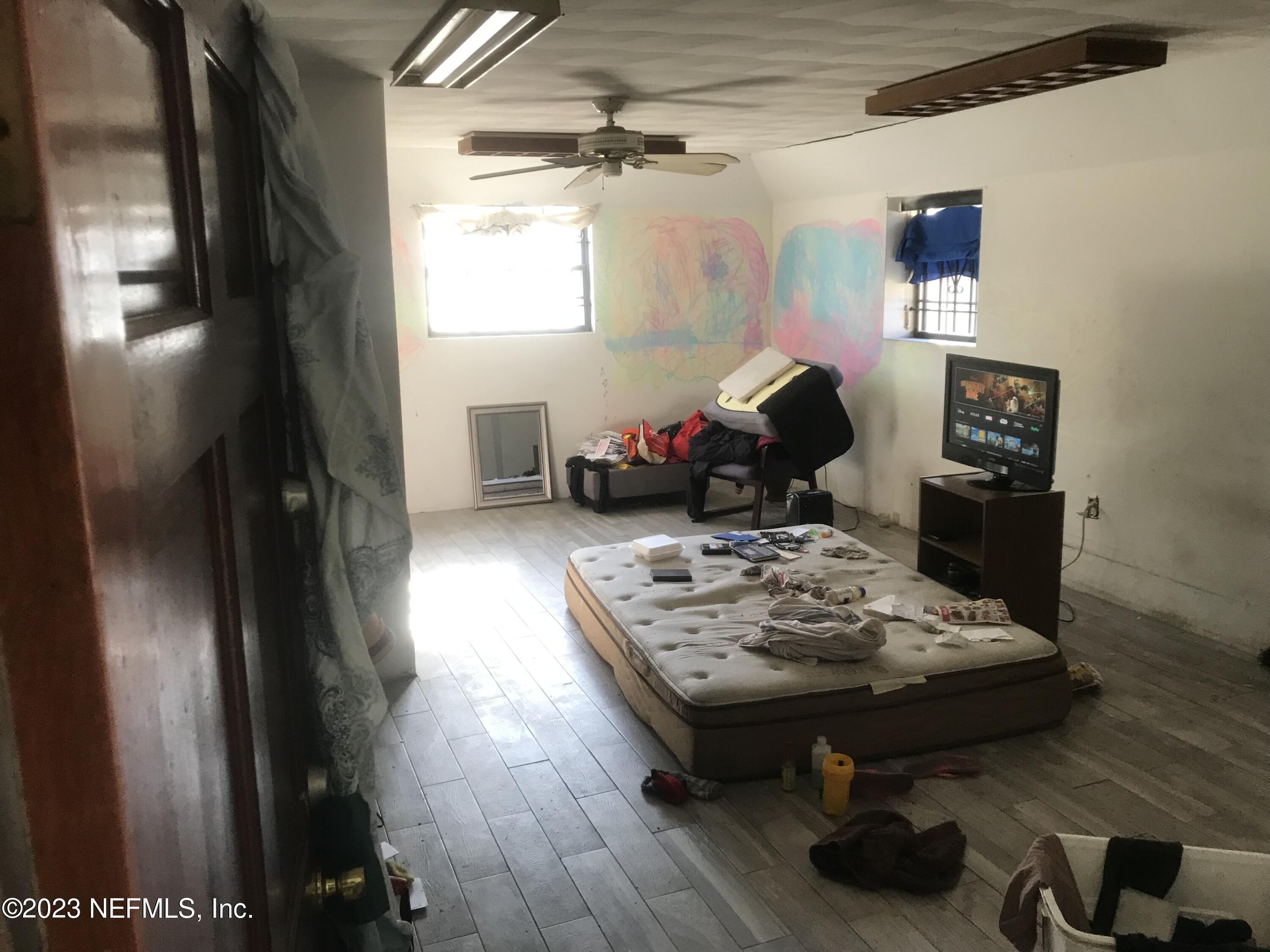 8063 Appian Way Jacksonville, FL 32208 - Photo 12 of 27 a living room with furniture and a window