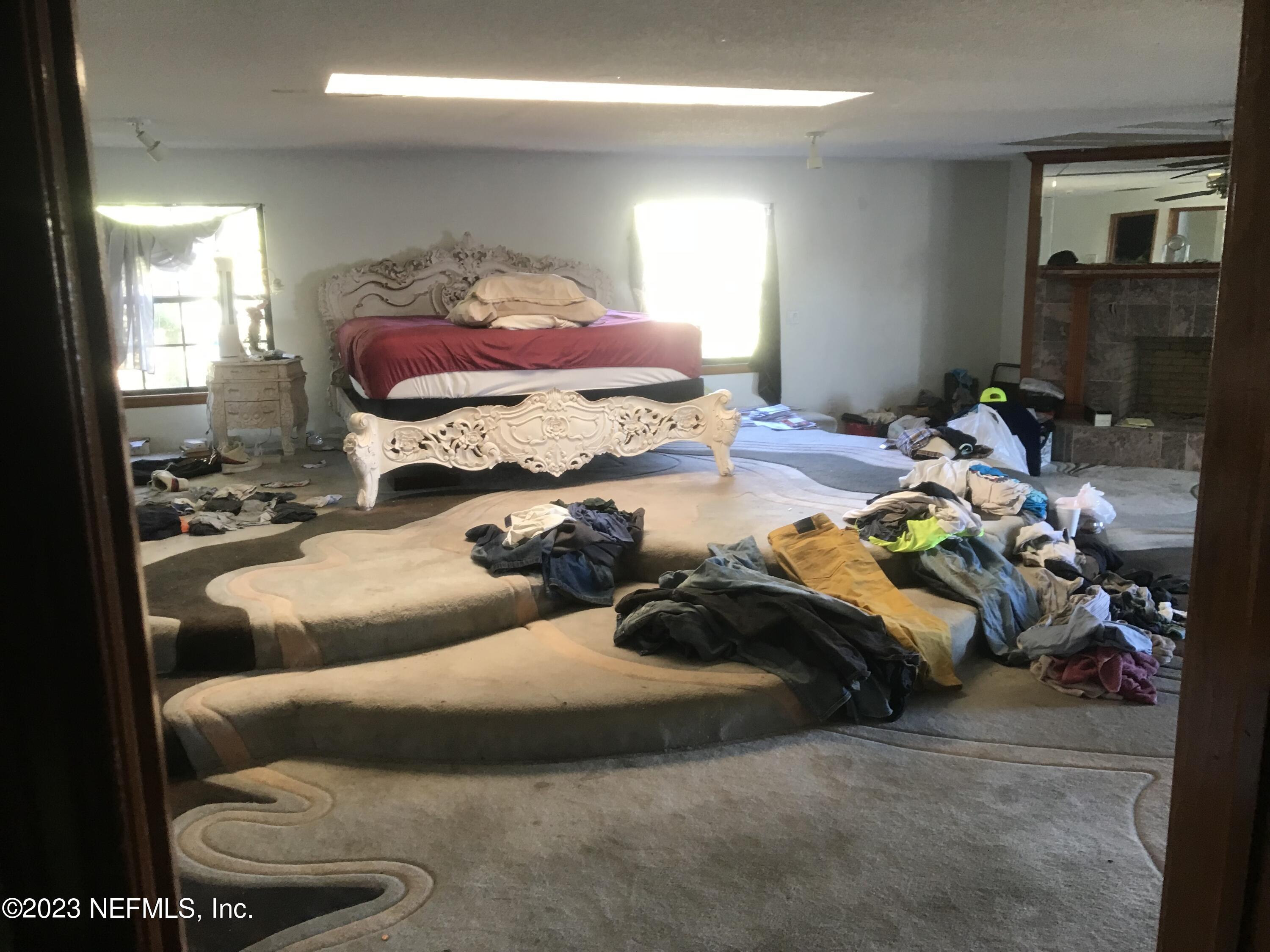 8063 Appian Way Jacksonville, FL 32208 - Photo 14 of 27 a bedroom with a bed and window