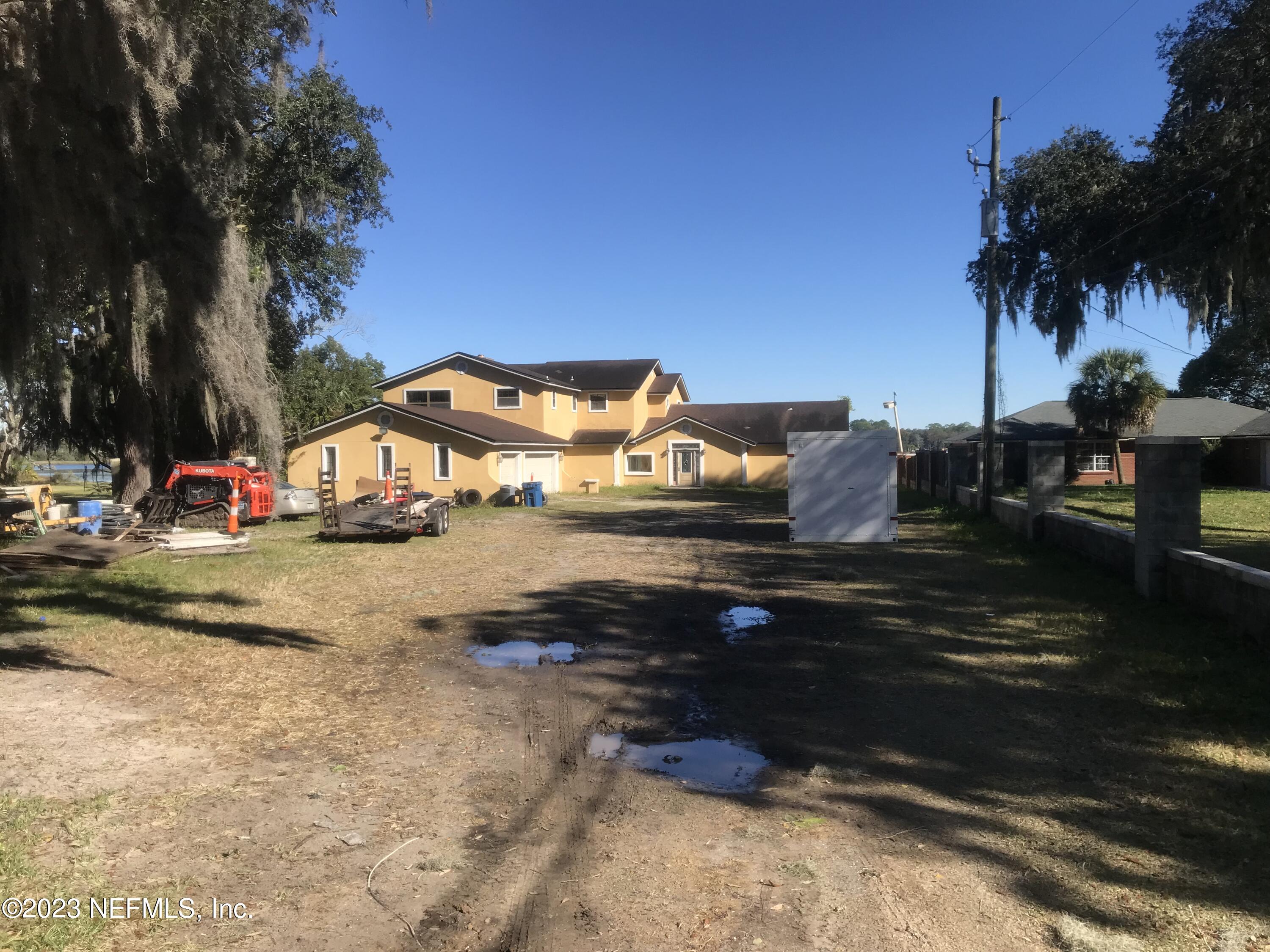 8063 Appian Way Jacksonville, FL 32208 - Photo 2 of 27 a view of street with houses