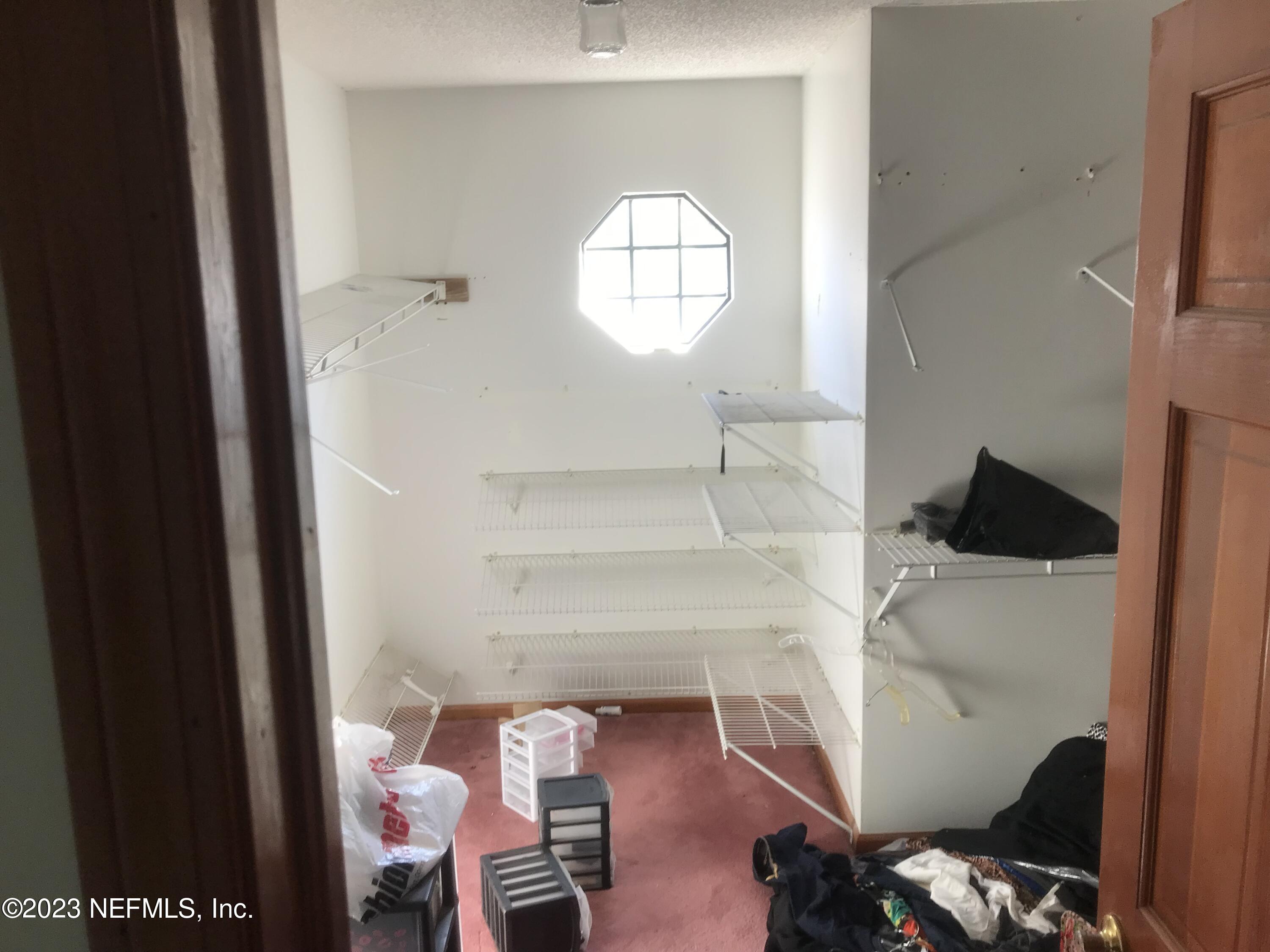8063 Appian Way Jacksonville, FL 32208 - Photo 22 of 27 a view of a livingroom with wooden floor and furniture