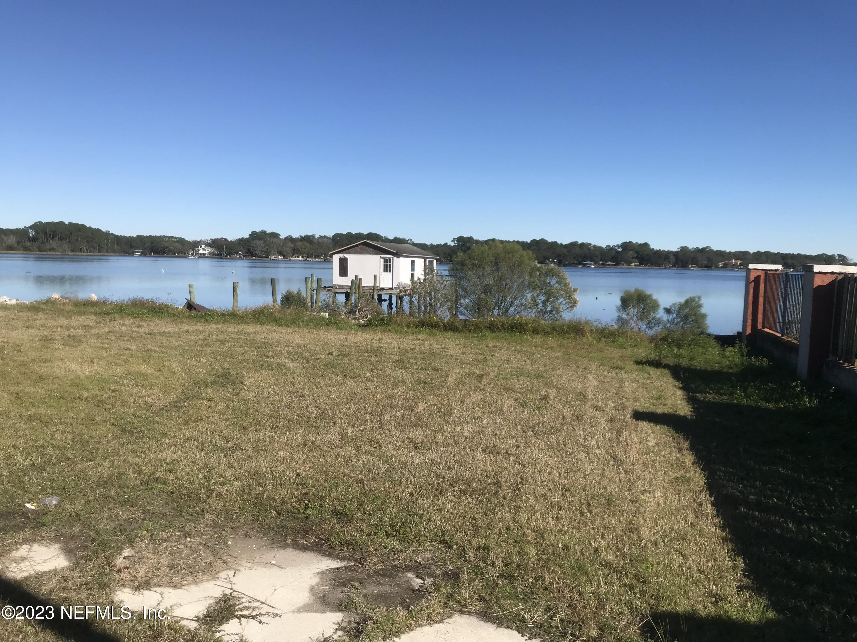 8063 Appian Way Jacksonville, FL 32208 - Photo 24 of 27 a view of a lake with a mountain in the background
