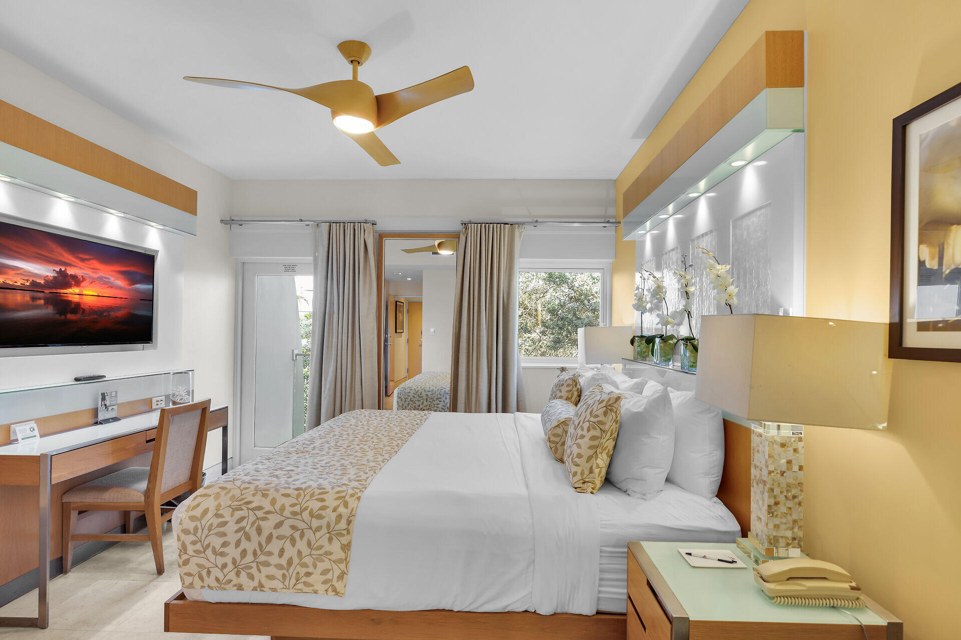 1401 Simonton Street, Unit 16 Key West, FL 33040 - Photo 11 of 29 a living room with furniture and a flat screen tv