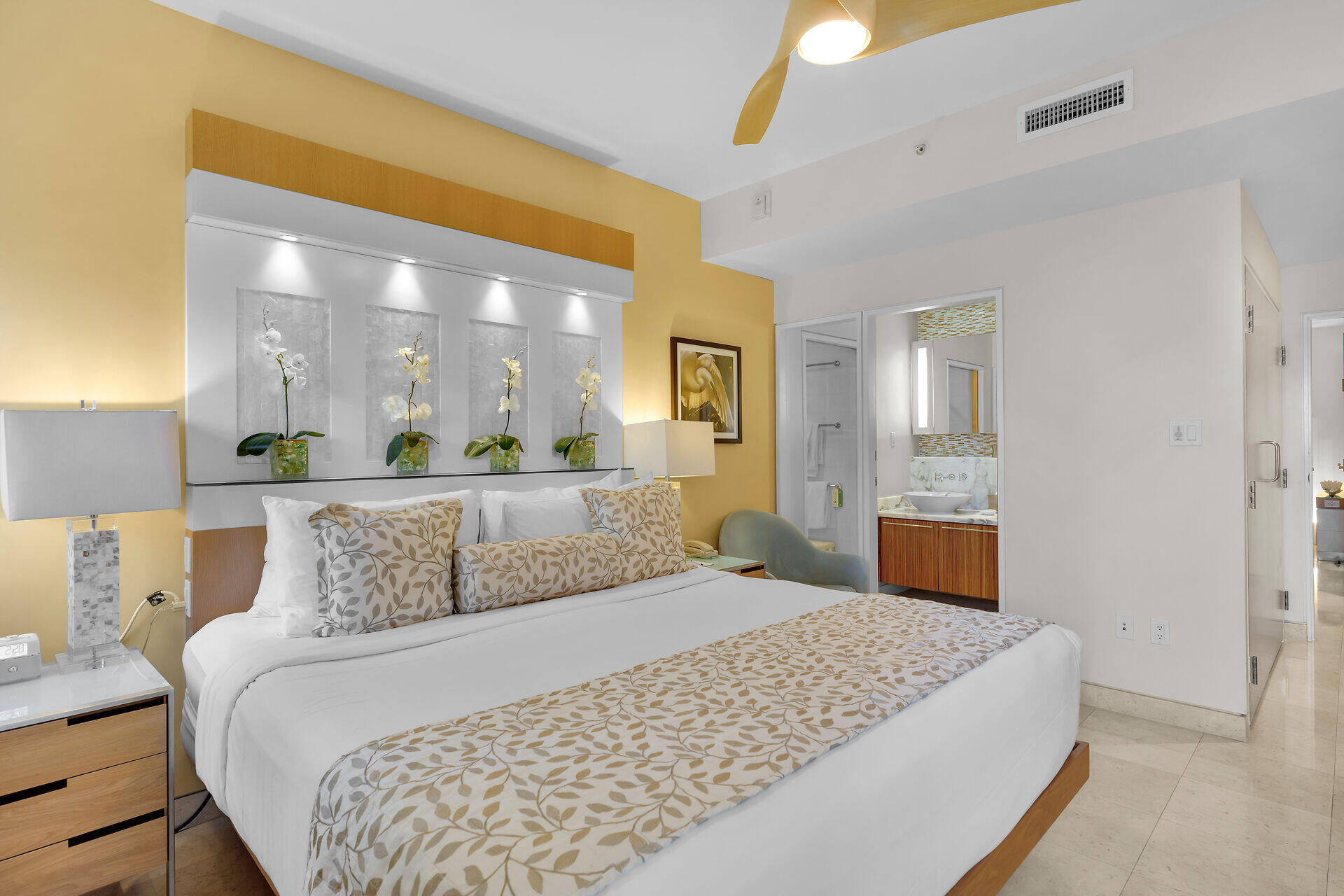 1401 Simonton Street, Unit 16 Key West, FL 33040 - Photo 12 of 29 a bedroom with a large bed and a chandelier