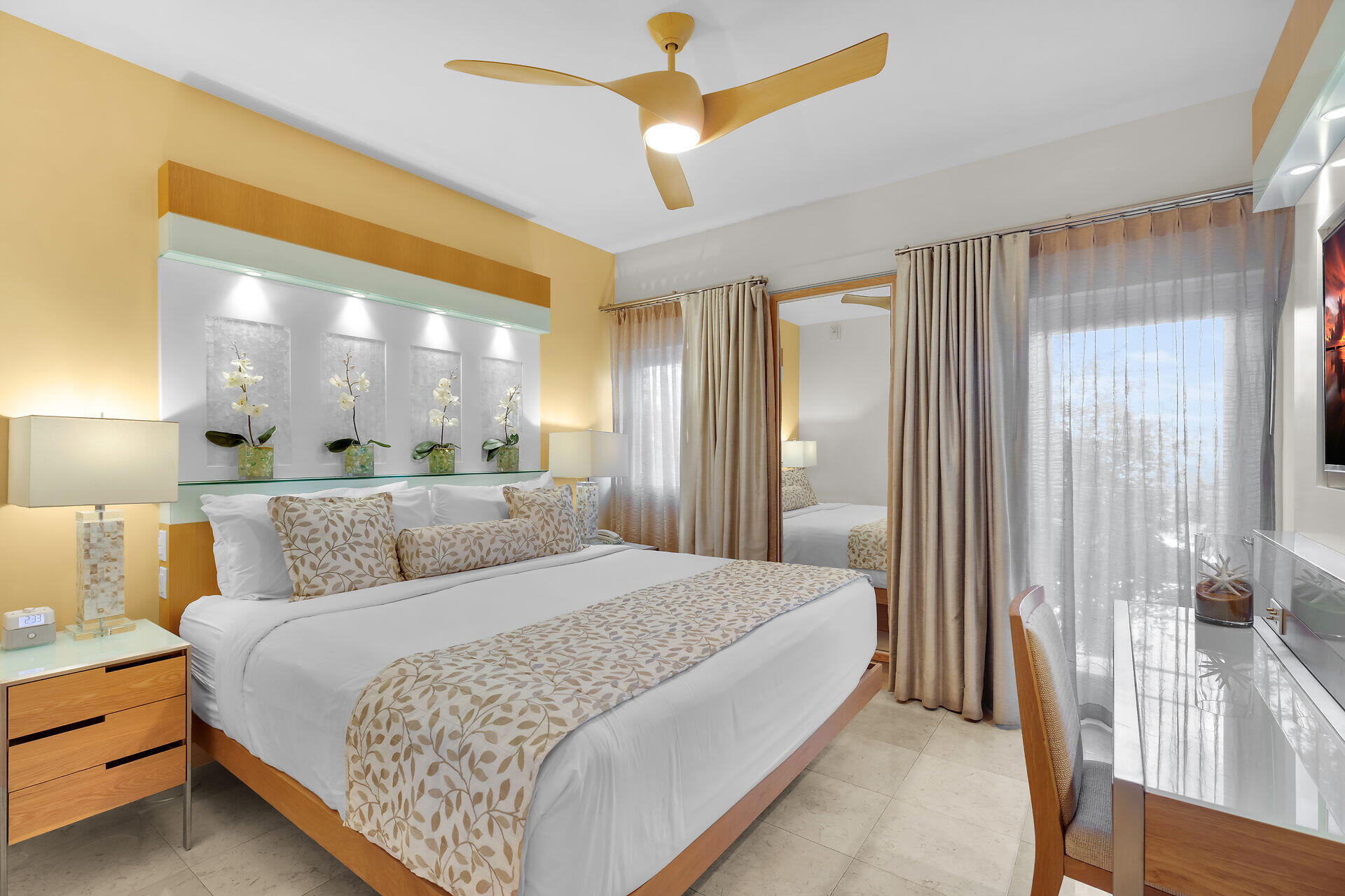 1401 Simonton Street, Unit 16 Key West, FL 33040 - Photo 13 of 29 a bedroom with a large bed and a chandelier