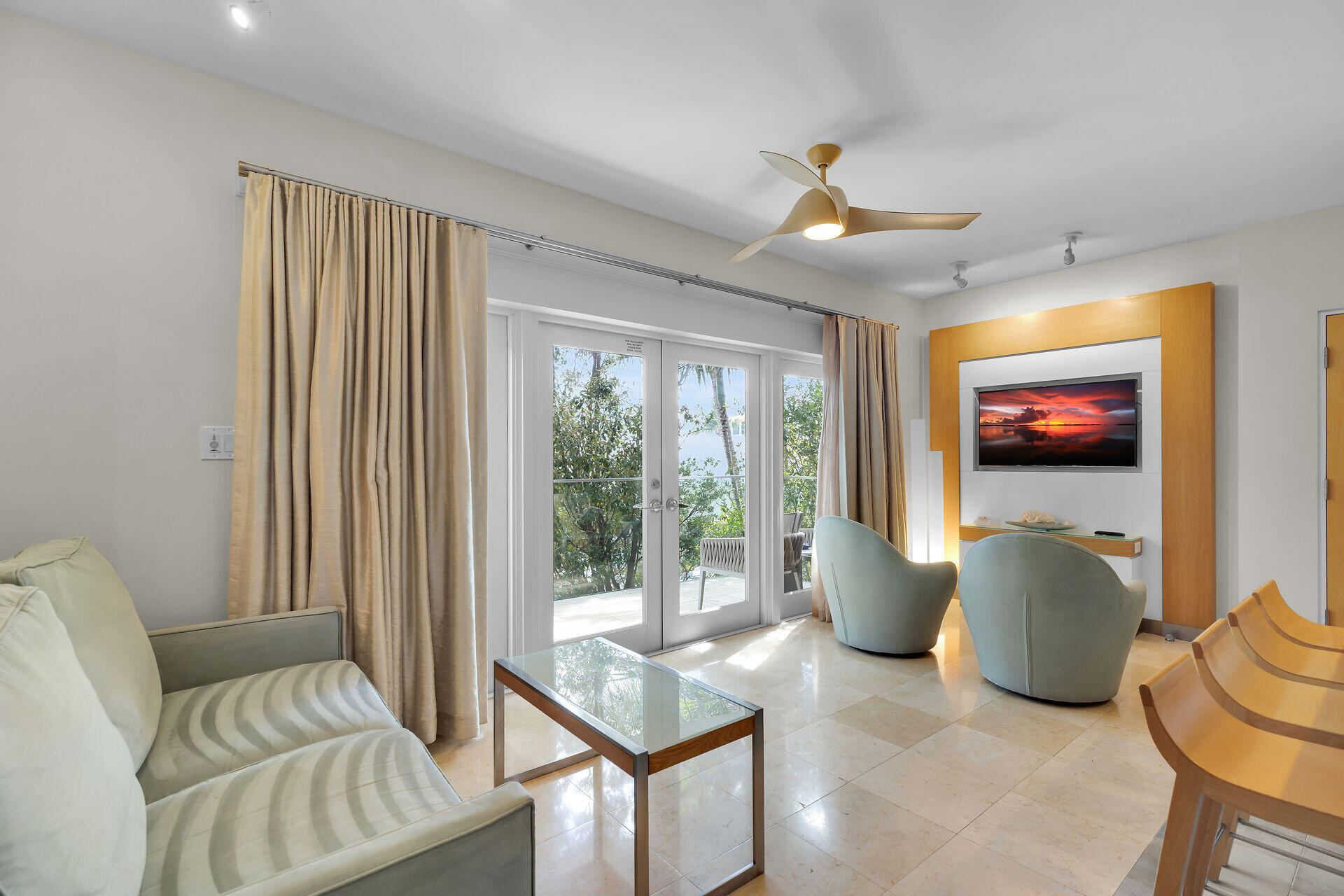 1401 Simonton Street, Unit 16 Key West, FL 33040 - Photo 3 of 29 a living room with furniture and a large window