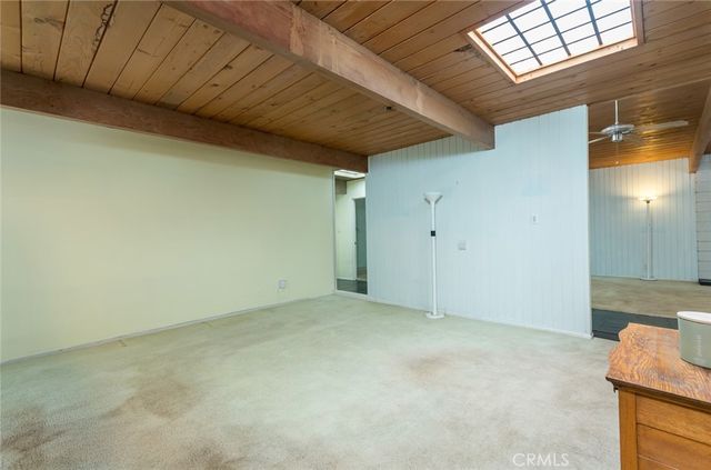 a kitchen with a sink a counter top space cabinets and appliances