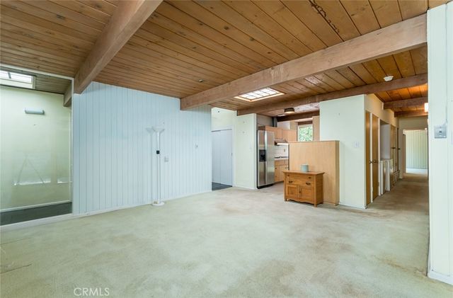 a kitchen with stainless steel appliances granite countertop a sink and a stove
