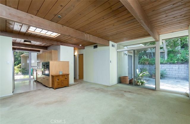 a kitchen with cabinets a sink and appliances