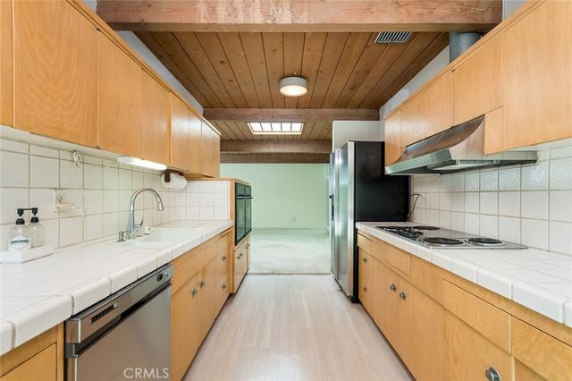 a view of a room with sliding door and wooden roof