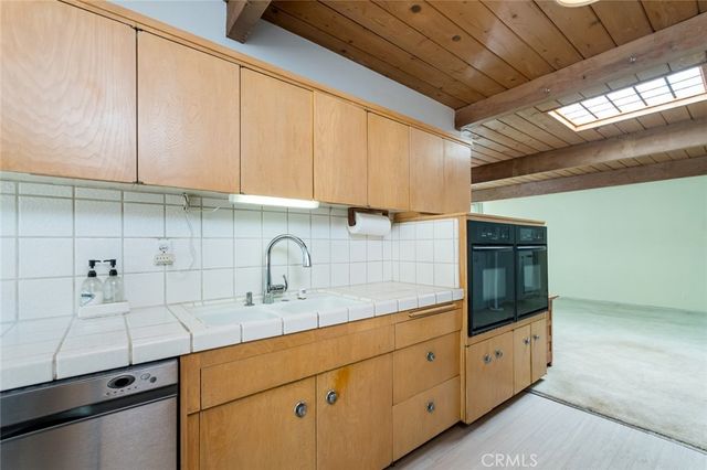 a view of a livingroom with a patio and wooden floor