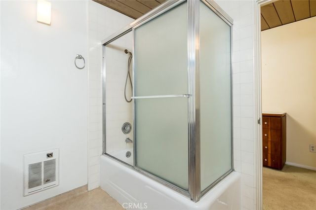a bathroom with a shower and a toilet