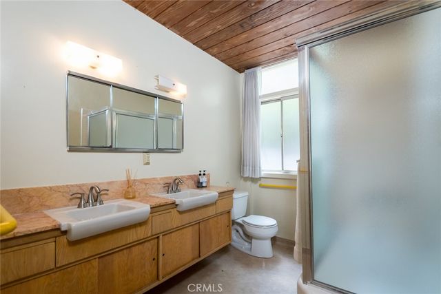 a view of porch with a table and chairs under an umbrella