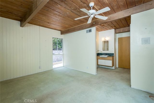 a backyard of a house with seating space