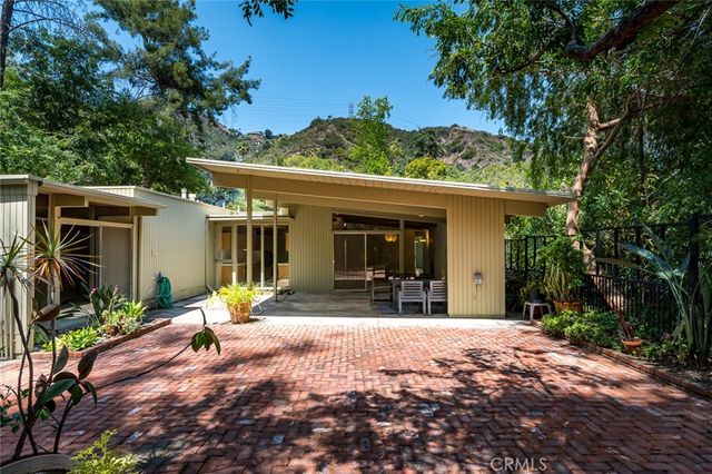 a view of a pathway with a tree