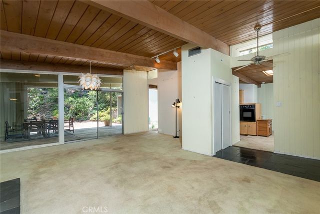 a view of empty room with a fireplace