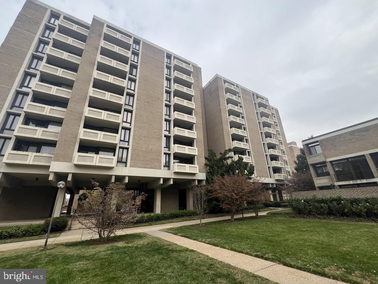 490 M Street Southwest, Unit W505 Washington, DC 20024 - Photo 11 of 18 a front view of a building with glass windows and plants