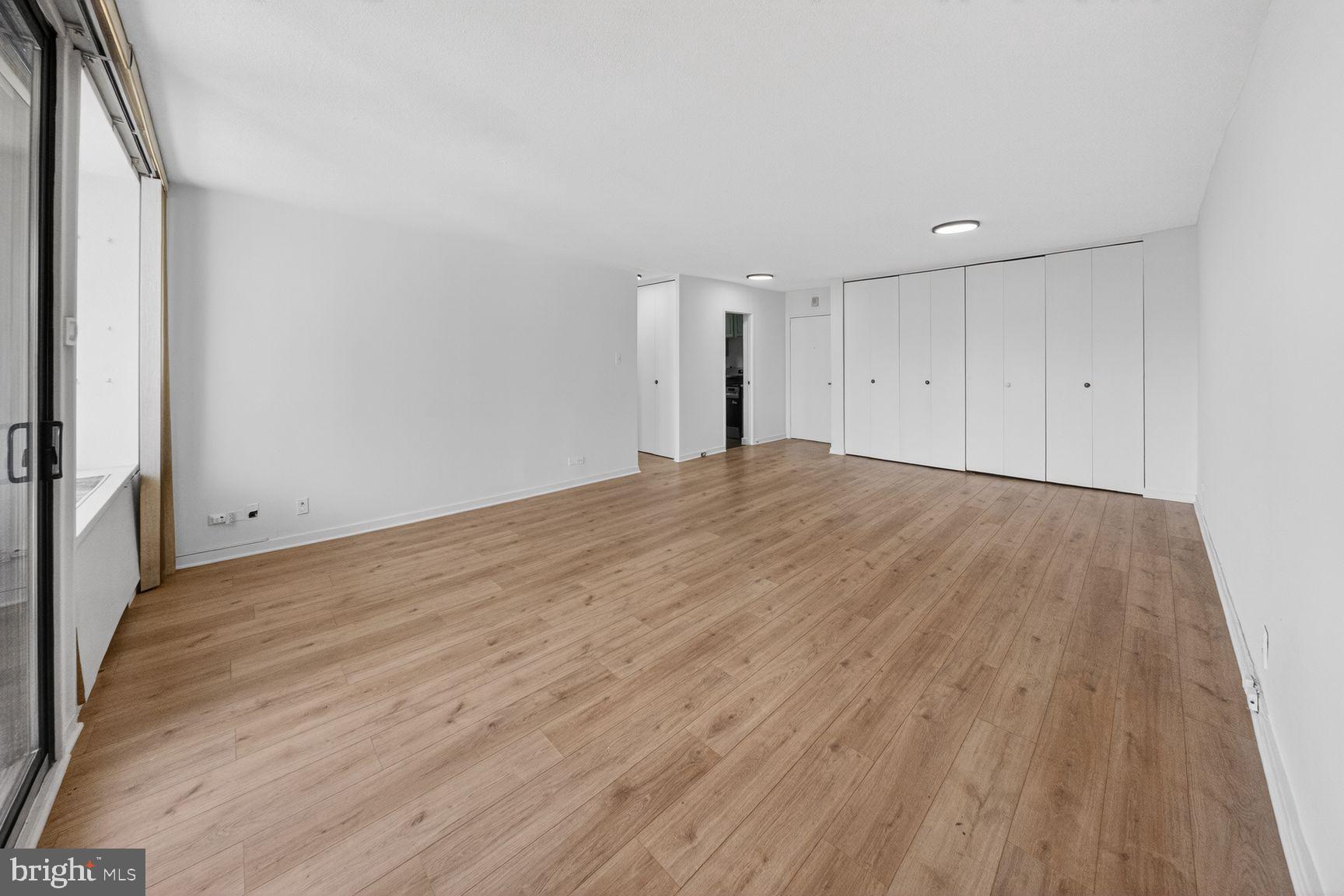 490 M Street Southwest, Unit W505 Washington, DC 20024 - Photo 16 of 18 a view of an empty room and wooden floor