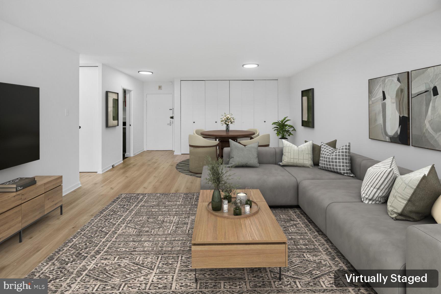 490 M Street Southwest, Unit W505 Washington, DC 20024 - Photo 2 of 18 a living room with furniture and a flat screen tv