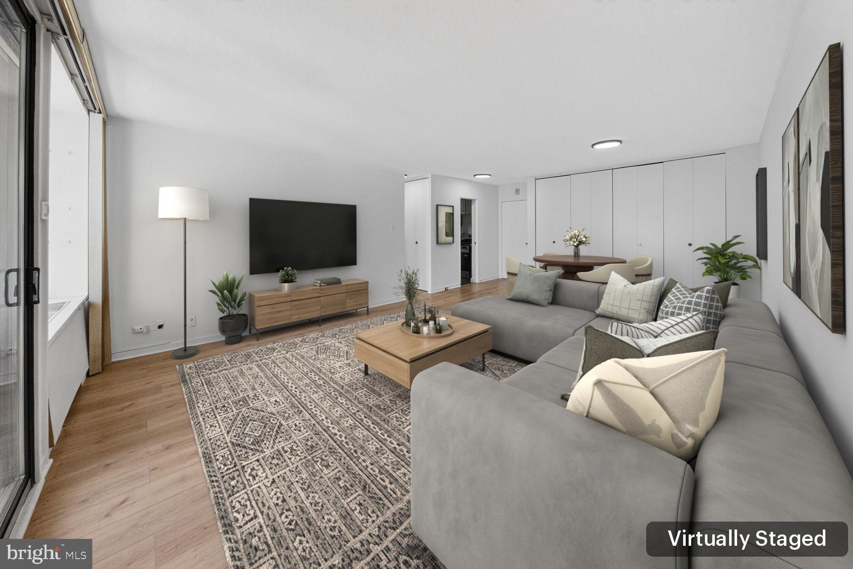 490 M Street Southwest, Unit W505 Washington, DC 20024 - Photo 3 of 18 a living room with furniture and a flat screen tv
