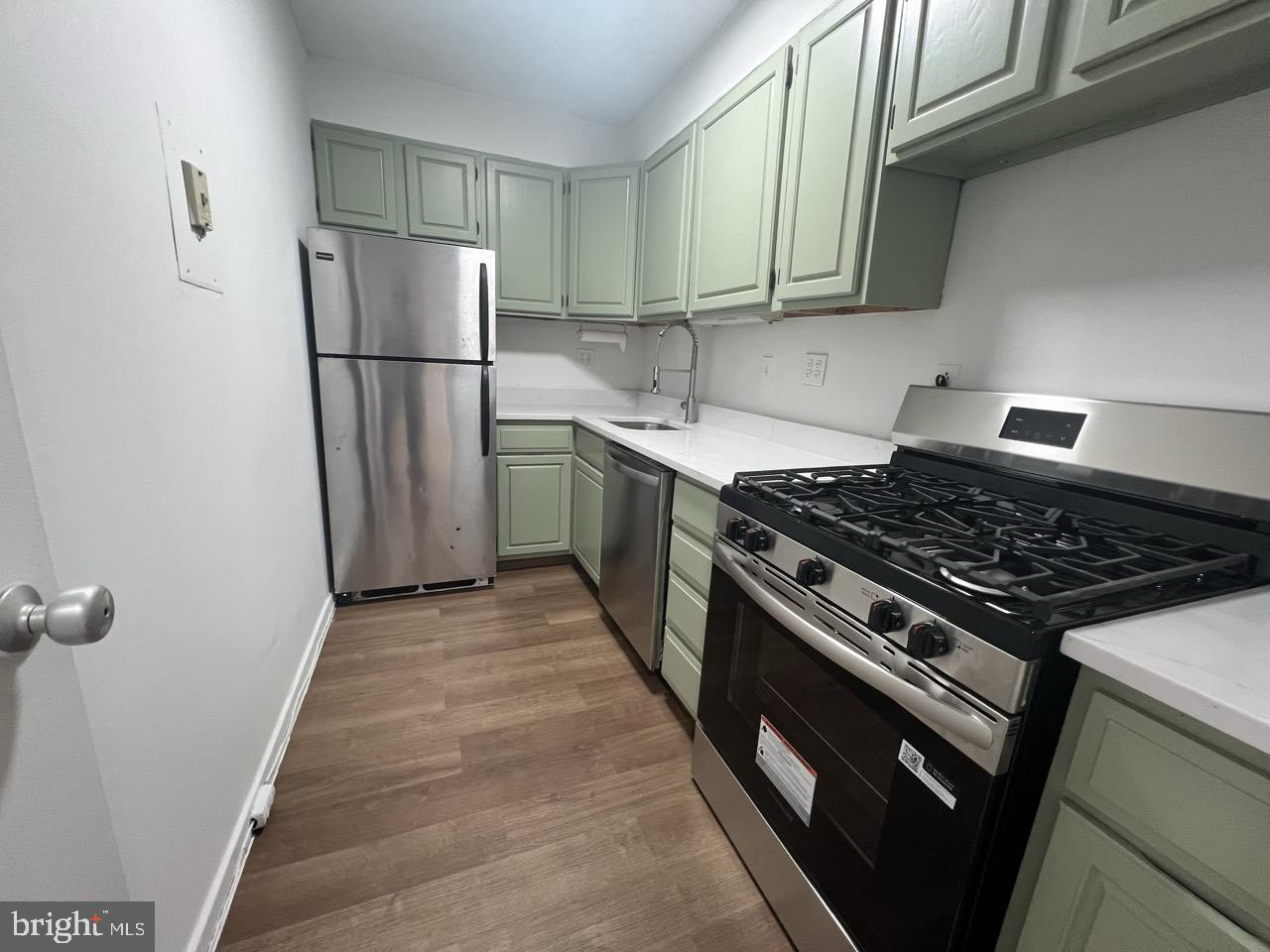 490 M Street Southwest, Unit W505 Washington, DC 20024 - Photo 5 of 18 a kitchen with a stove a refrigerator and a sink