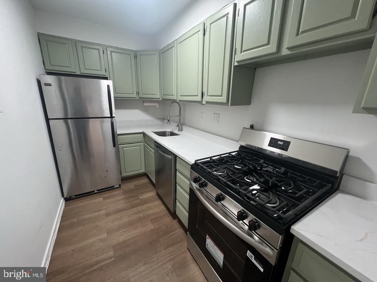 490 M Street Southwest, Unit W505 Washington, DC 20024 - Photo 7 of 18 a kitchen with stainless steel appliances granite countertop a stove a refrigerator and a refrigerator