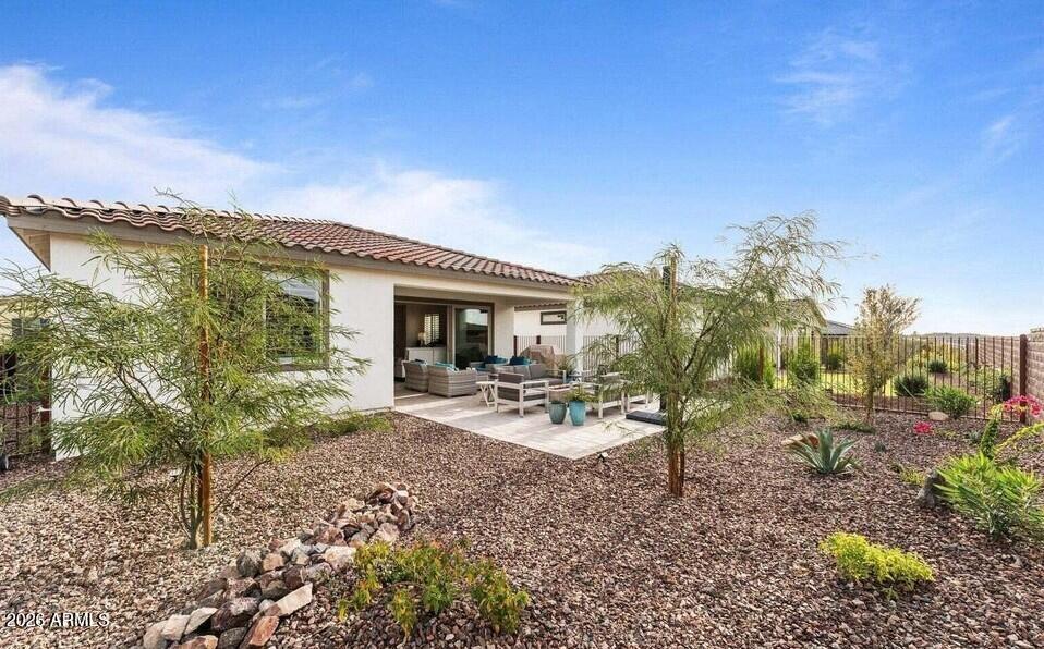 4540 Jackpot Road Wickenburg, AZ 85390 - Photo 13 of 13 a view of a house with backyard porch and sitting area